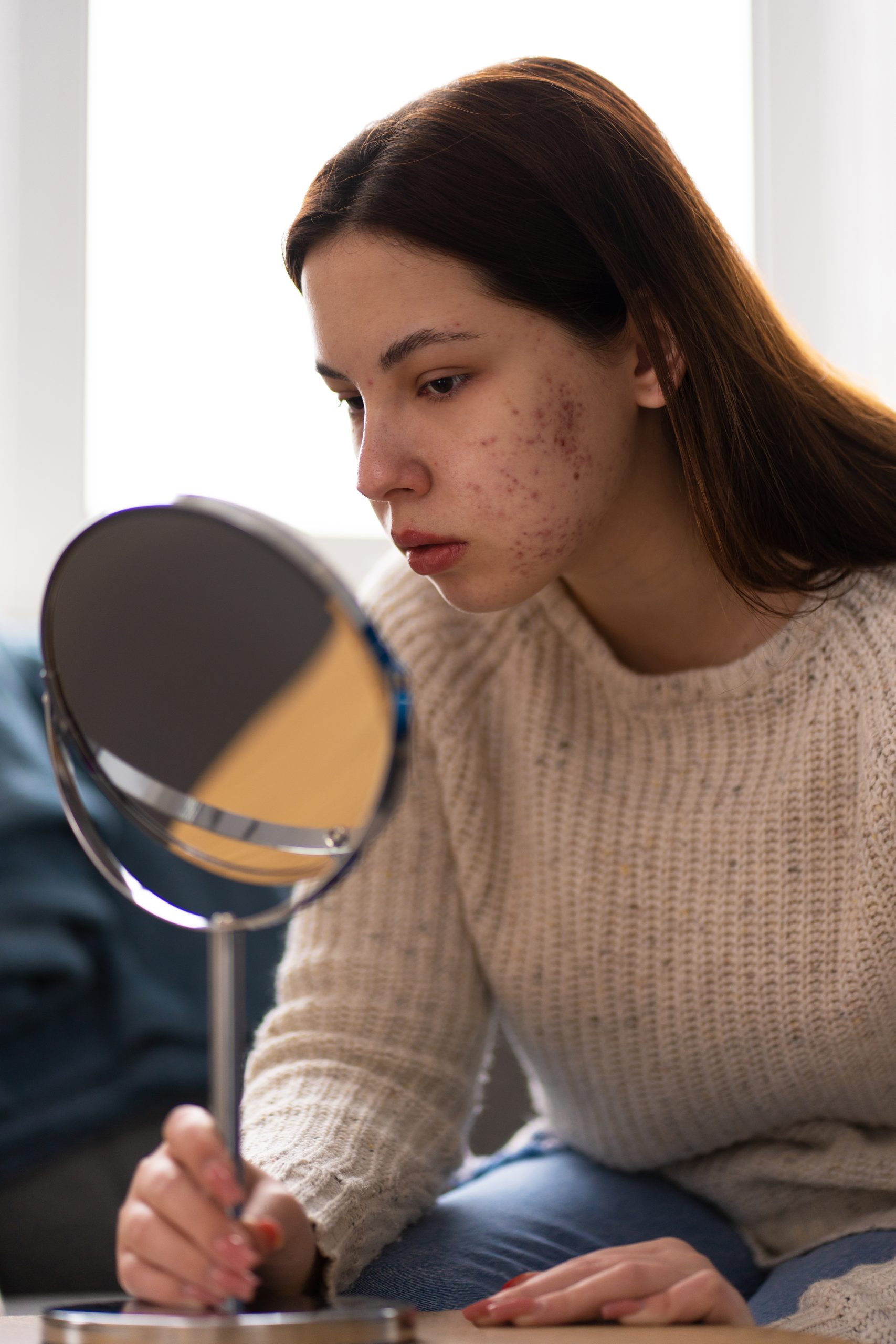 Calm skincare consultation moment — woman with healthy skin